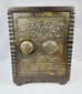 Vintage American cast iron safe bank with ornate Victorian detailing