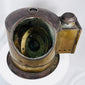 Shipboard brass binnacle compass displaying authentic maritime wear and historical character