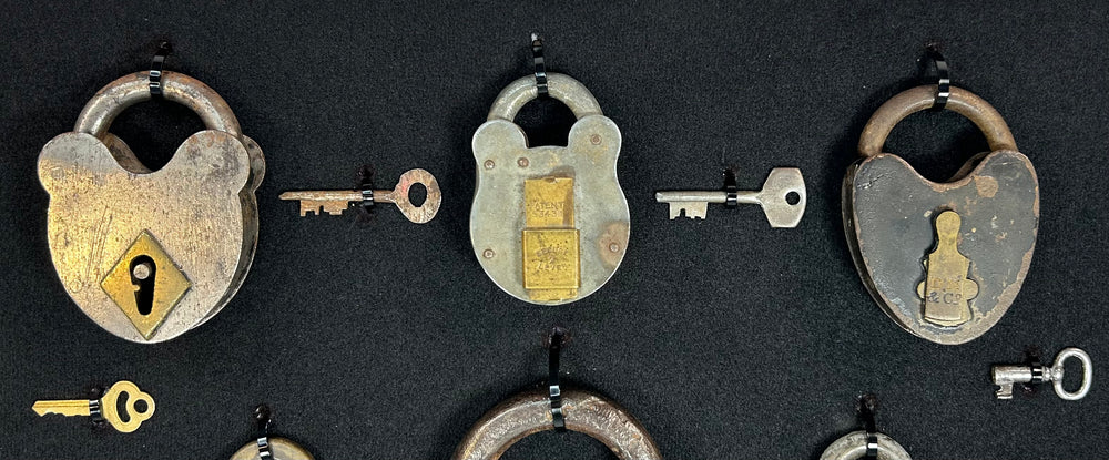 Vintage lock and key collection with U.S. marked and Old Glory padlocks