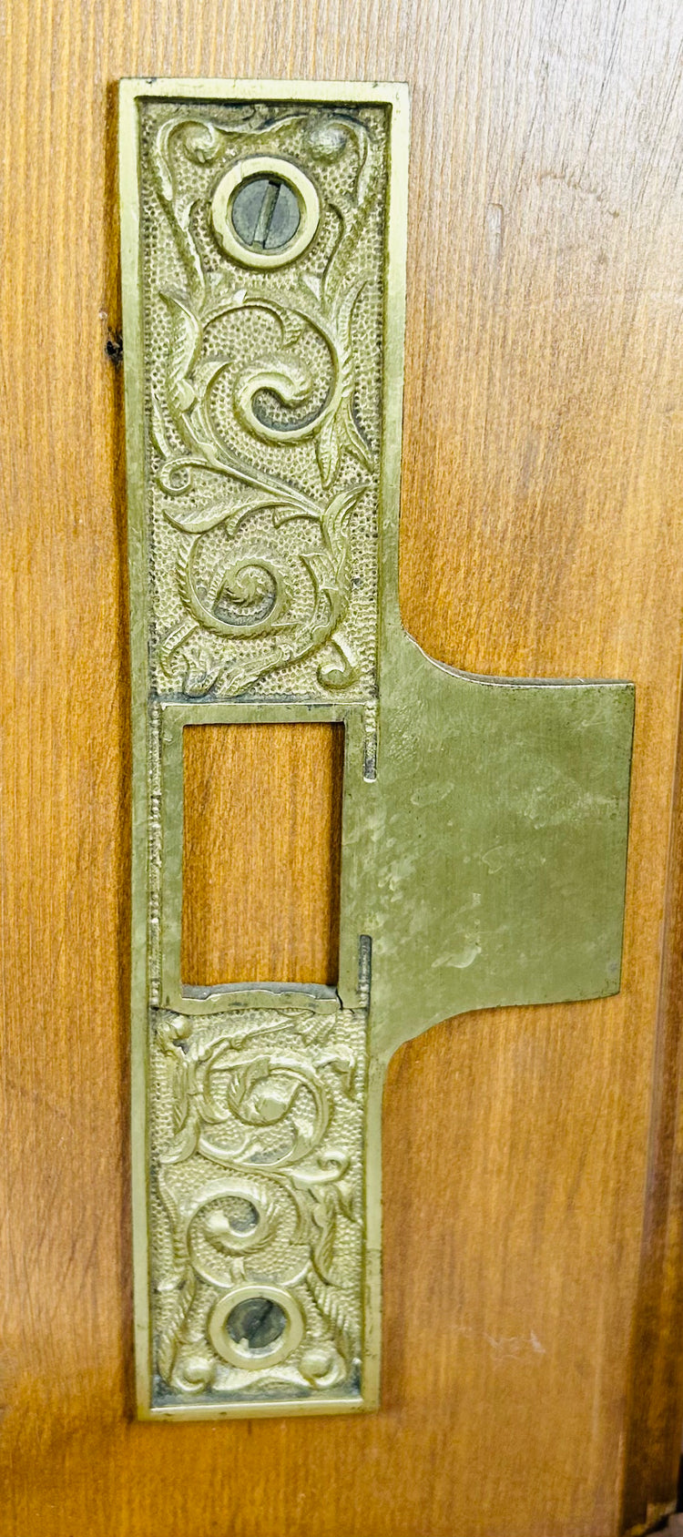 Antique door lock display with original key and mortise mechanism visible