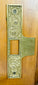 Antique door lock display with original key and mortise mechanism visible