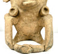 Ancient Mesoamerican terracotta figure with distinctive headpiece projections, sculpted facial details, and visible surface abrasions.