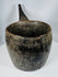 Antique wooden ritual container from the Himalayan region with extensive age-related wear