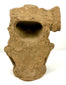 Pre-Columbian seated human figurine attributed to Mesoamerica, circa 200–800 CE, featuring circular ear ornaments, a decorative headdress, and weathered tan terracotta.