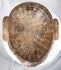 Antique African tribal mask with remnants of pigment and expressive anthropomorphic form
