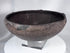 Pre-Columbian ceramic bowl with dark firing coloration and sculptural rounded profile