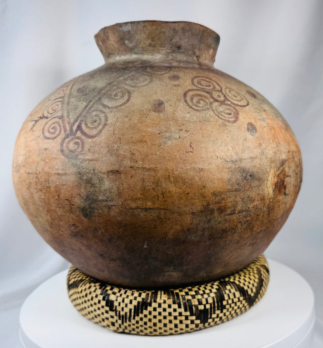 Ethnographic Timorese pottery vessel with globular body and traditional painted geometric motifs