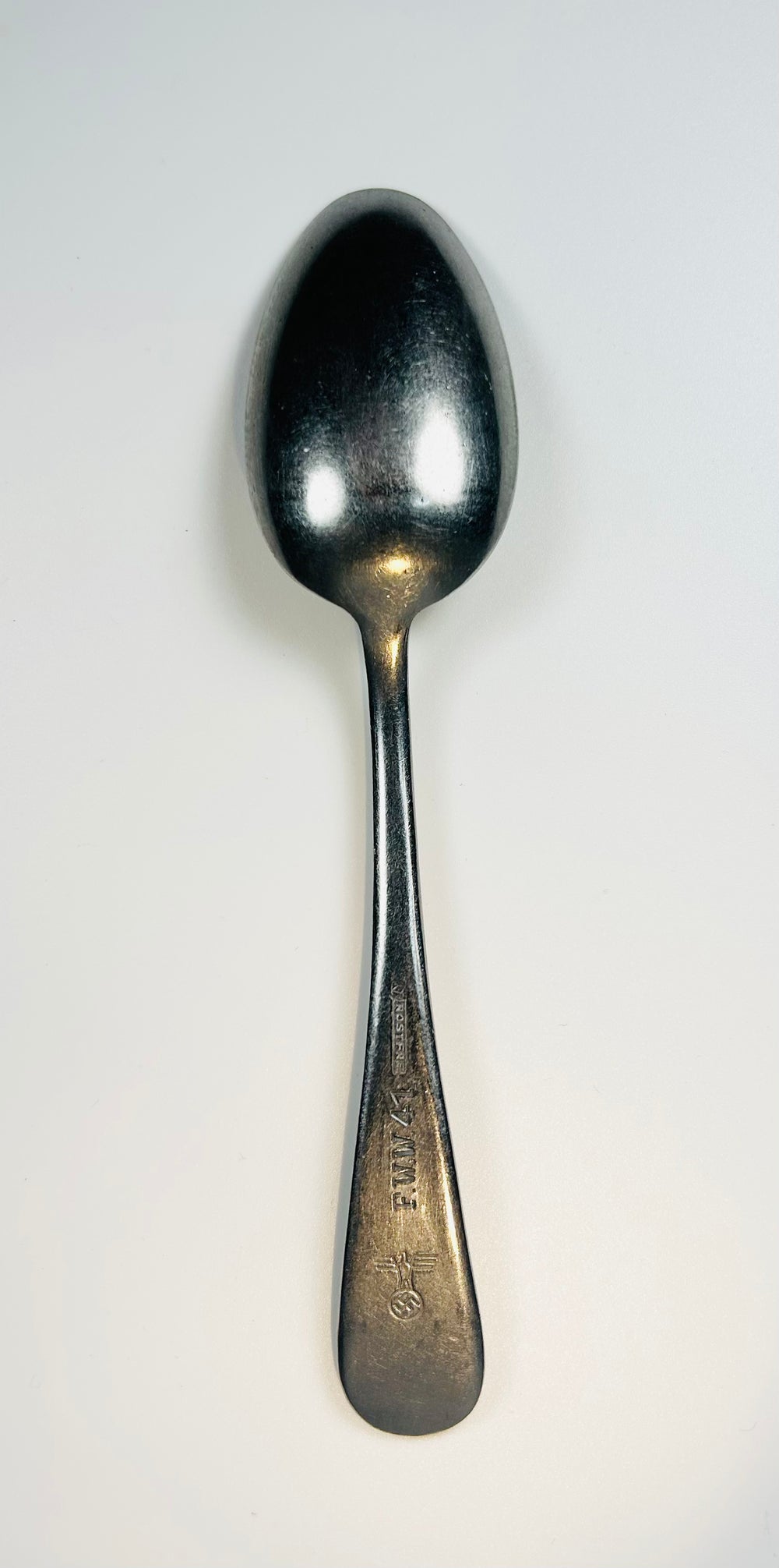 WWII German Kriegsmarine spoon showing stamped handle with F.W.W. 41 marking and Reich eagle insignia