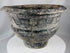 Thai Ban Chiang-inspired pottery vessel featuring textured surface patterns and sculptural form