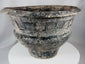 Thai Ban Chiang-inspired pottery vessel featuring textured surface patterns and sculptural form