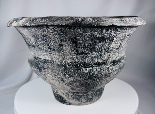 Ban Chiang-style ceramic pot with broad rim, crosshatched texture, and aged surface treatment