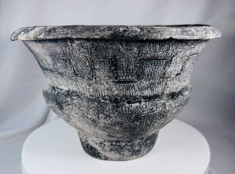 Ban Chiang-style ceramic pot with broad rim, crosshatched texture, and aged surface treatment