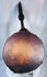 Antique Nepal shamanic drum with anthropomorphic carved handle and original curved wooden beater.
