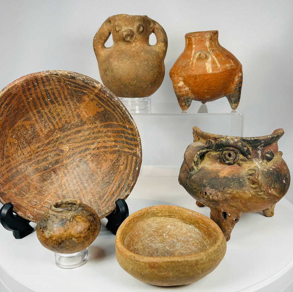 Ancient ceramic artifact group with Indigenous pottery including painted bowl, effigy vessels, and tripod vessel