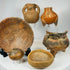 Ancient ceramic artifact group with Indigenous pottery including painted bowl, effigy vessels, and tripod vessel