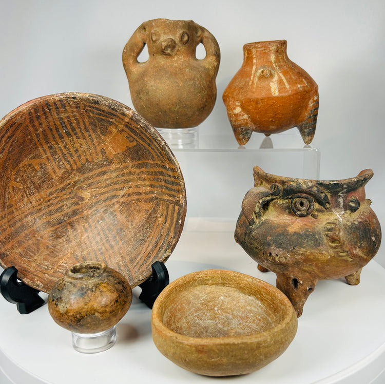 Ancient ceramic artifact group with Indigenous pottery including painted bowl, effigy vessels, and tripod vessel