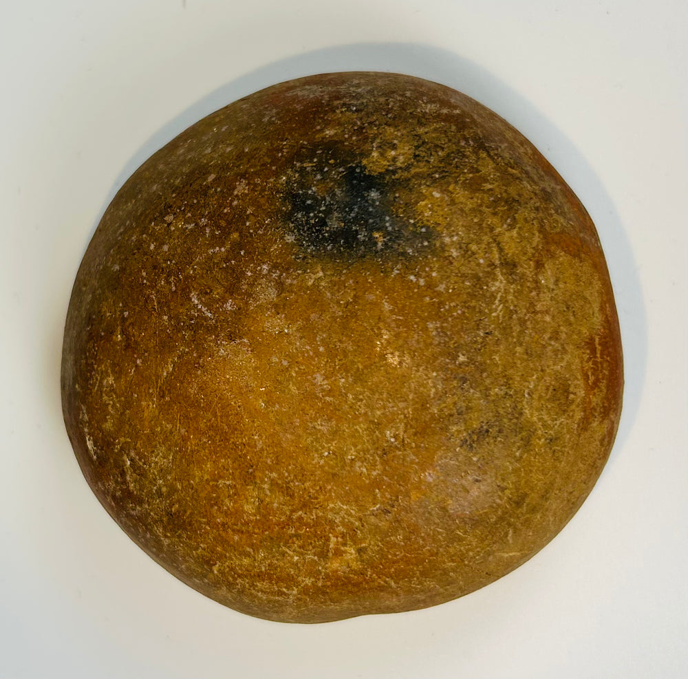 Ancient hand-formed pottery bowl with natural patina and smooth interior from Pre-Columbian culture