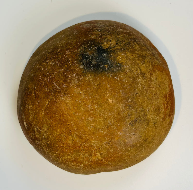 Ancient hand-formed pottery bowl with natural patina and smooth interior from Pre-Columbian culture