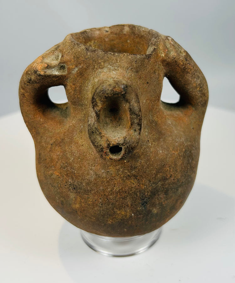 Ancient effigy pottery vessel with animal-like form and pronounced facial features from Pre-Columbian culture