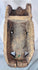 Traditional tribal mask with carved teeth, prominent nose, and dark aged hardwood construction.