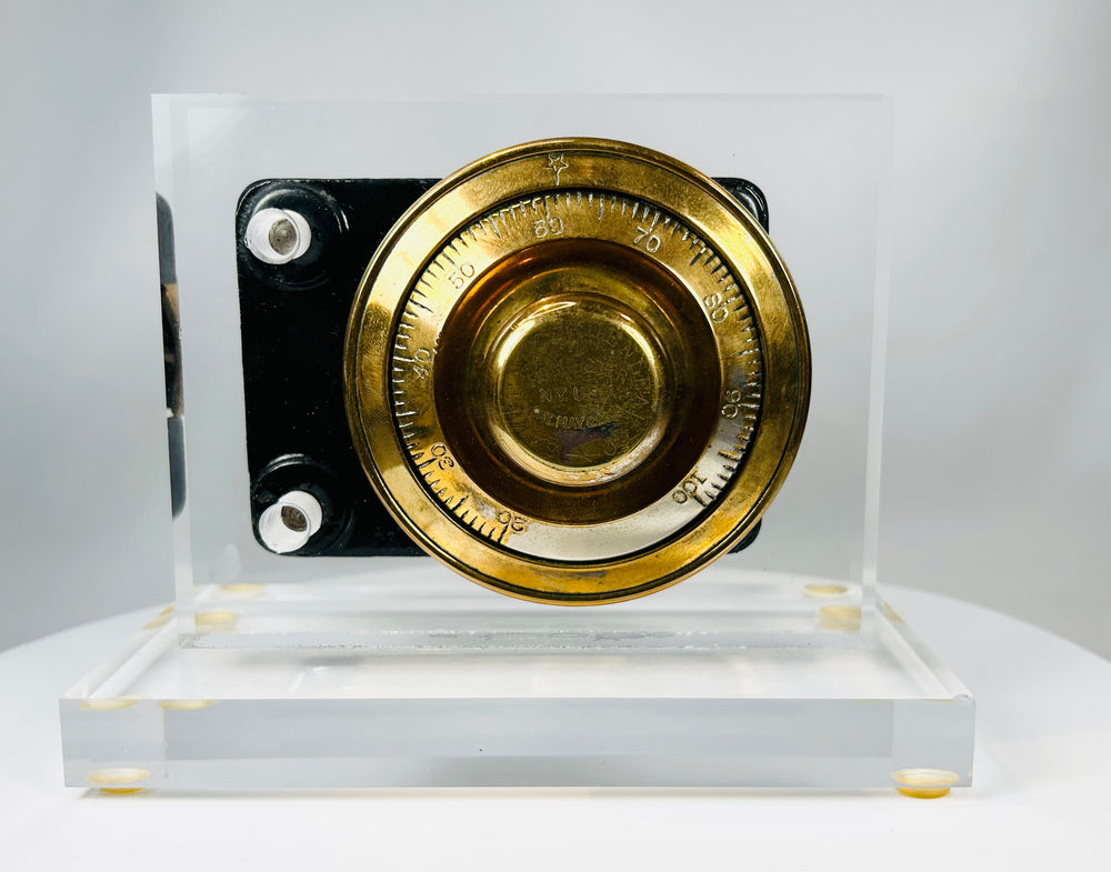 Historic American safe lock front with rotating dial and engraved bezel