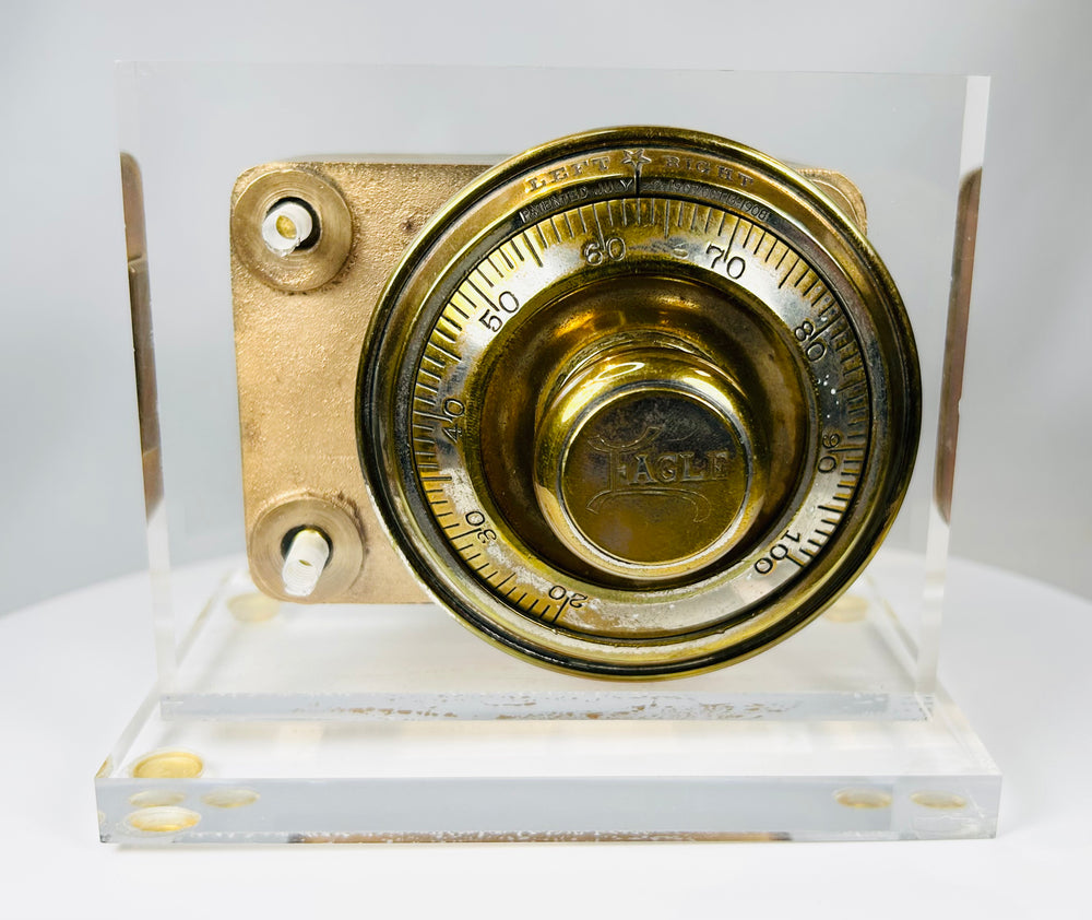 Antique combination dial lock mechanism with cast metal body and patina