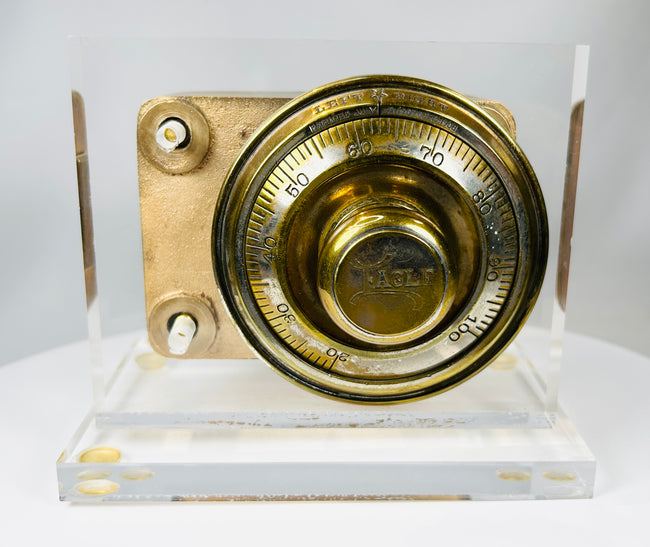 Antique combination dial lock mechanism with cast metal body and patina