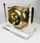 Historic safe lock front view with numbered brass dial and maker marking