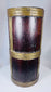 Antique Tibetan food storage container constructed from hardwood and reinforced with brass strips.