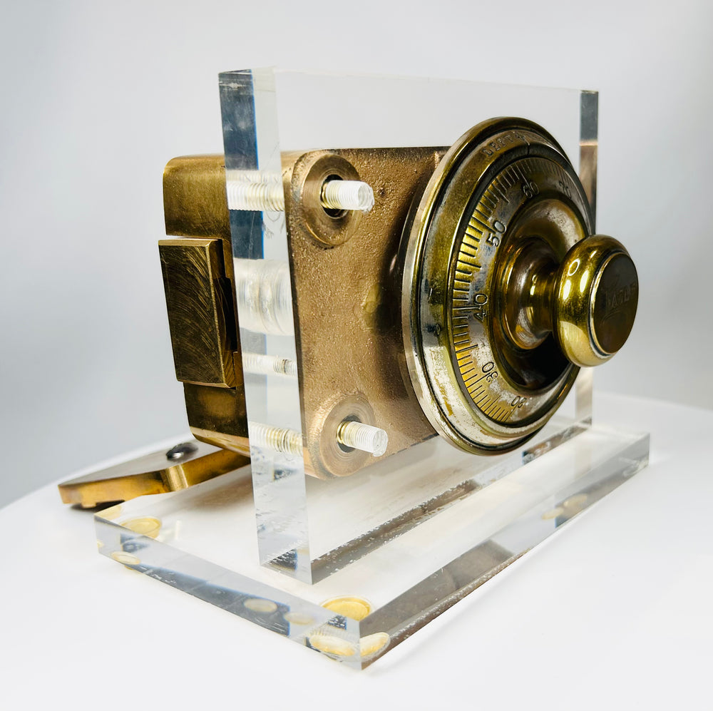 Antique vault lock mechanism with rotating dial and cast metal housing