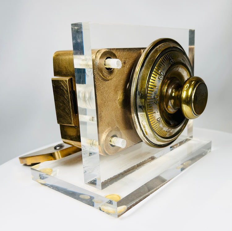 Antique vault lock mechanism with rotating dial and cast metal housing