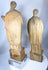 Hand-carved Christian figures with intricate robe decoration and centuries of aged character.