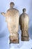 Hand-carved Christian saint figures in wood featuring detailed vestments and expressive facial features.