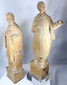 European devotional wooden figures displaying hand-carved drapery folds and ecclesiastical attire.