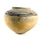 Full side view of bulbous Huastec pottery with surface wear