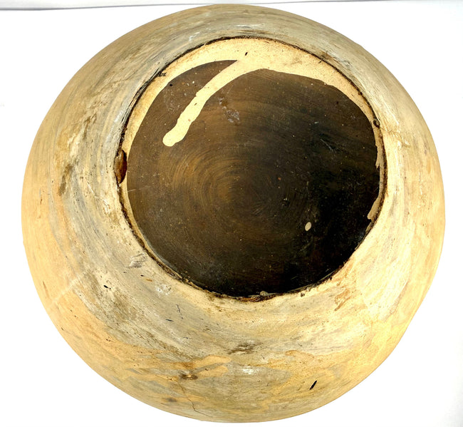 Close-up of terracotta jar opening with thick rim and interior marks