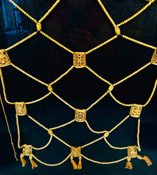 Tibetan tantric apron with bone bead lattice and painted deities