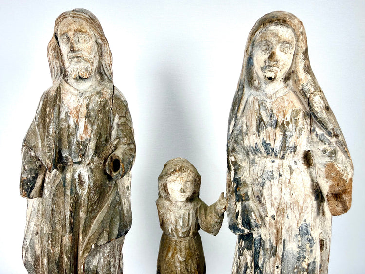 Frontal view of hand-carved wooden Holy Family trio with weathered white and grey finish