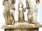 Lower section of Holy Family group showing carved robe drapery folds and child's feet