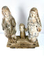 High-angle view of aged wood religious statues showing rough texture and connected hands