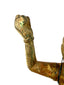 Close-up of raised arm showing green verdigris corrosion on bronze