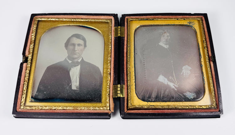 Victorian era husband and wife daguerreotypes displayed in decorative thermoplastic case