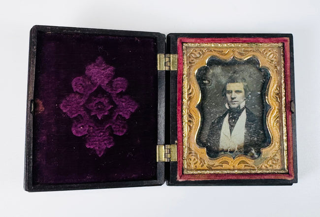 Mid-19th century daguerreotype portrait featuring a well-dressed Victorian gentleman