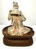 Ancient Chinese Tang Dynasty terracotta seated female musician playing a traditional pan flute, circa 618–907 CE.