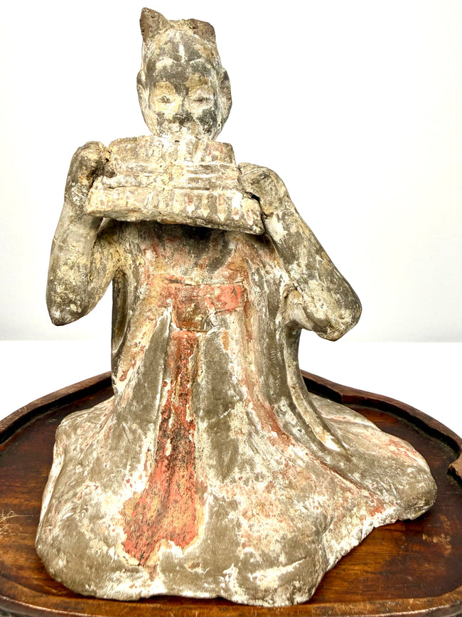 Ancient Chinese terracotta figurine seated woman playing pan flute detail