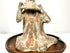 Chinese Tang Dynasty terracotta funerary figure featuring a finely modeled pan flute and intricate draped robe details.