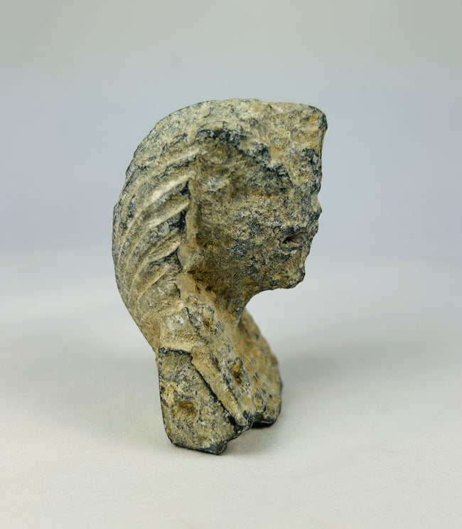 Historic Grand Tour limestone carving of a pharaoh’s head with nemes headdress and uraeus emblem, dated around 1800–1920, photographed on a neutral surface.