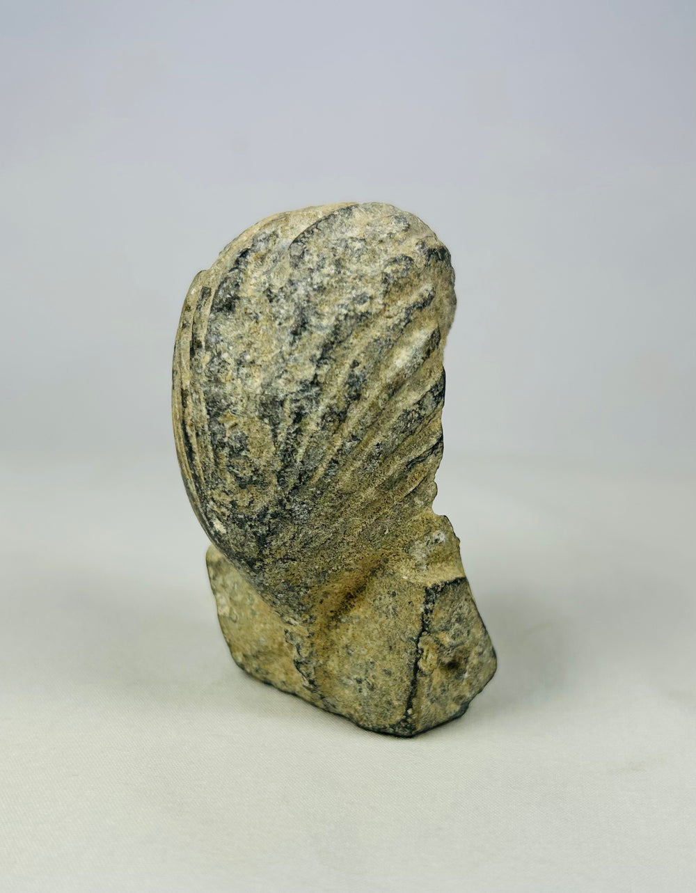 Carved limestone pharaoh head with traditional nemes headdress and cobra uraeus, European Grand Tour artifact circa 1800–1920, set against a neutral backdrop.