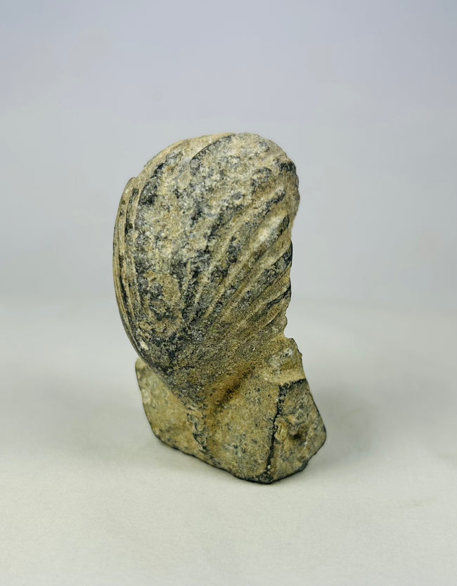 Carved limestone pharaoh head with traditional nemes headdress and cobra uraeus, European Grand Tour artifact circa 1800–1920, set against a neutral backdrop.