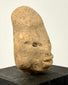 Three-quarter angle of Mesoamerican terracotta head showcasing protruding lips and extended skull length